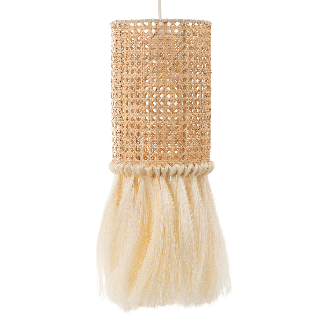 A cylindrical woven rattan lampshade with a sisal fringe hangs from a cord.