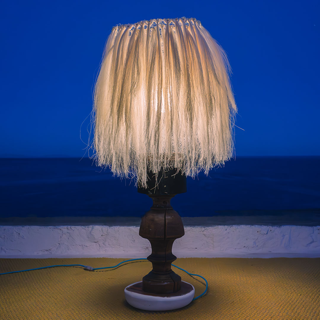 Lamp with sisal fibers seen at night