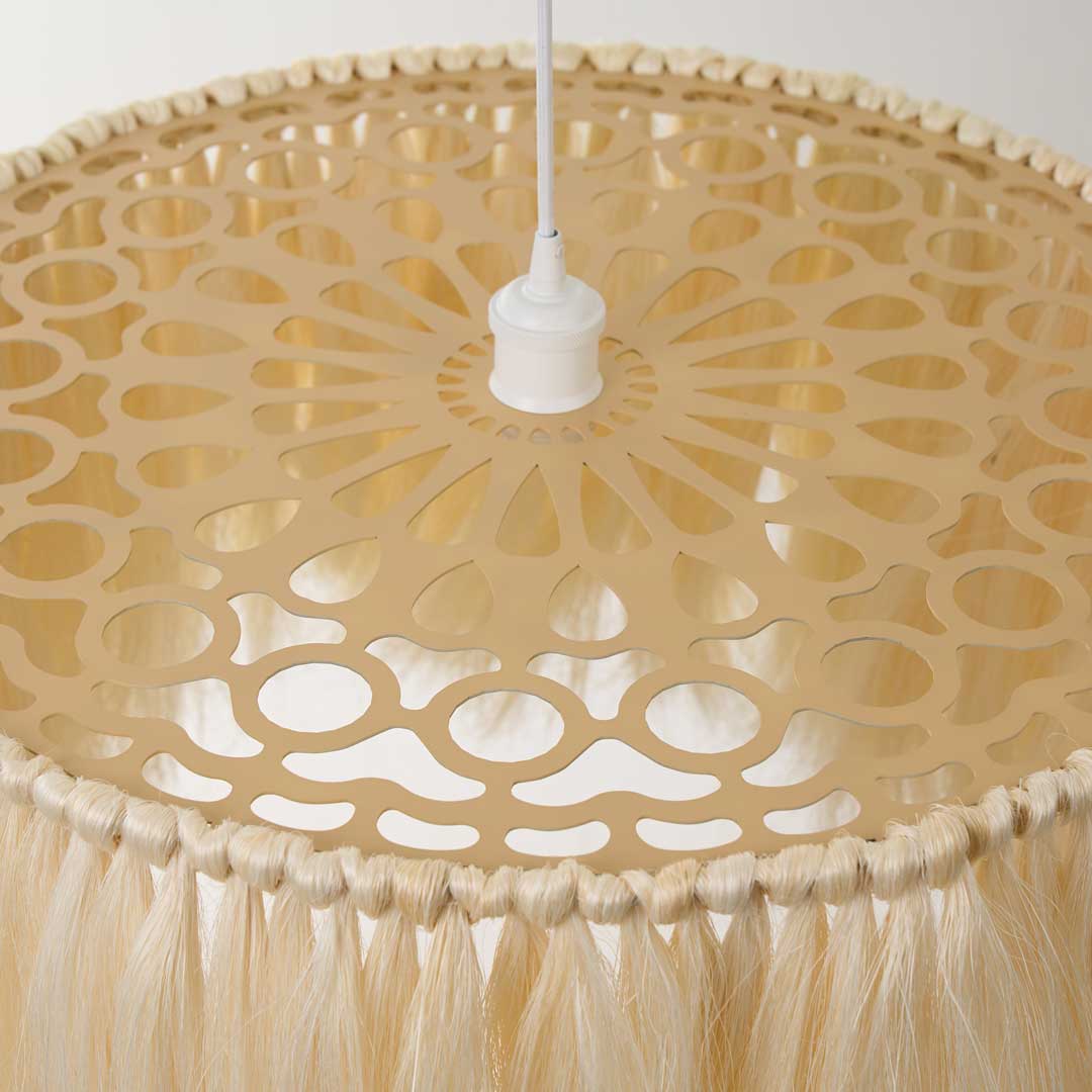 Close-up of the laser cut metal design with a geometric, symmetrical pattern of the pendant lamp